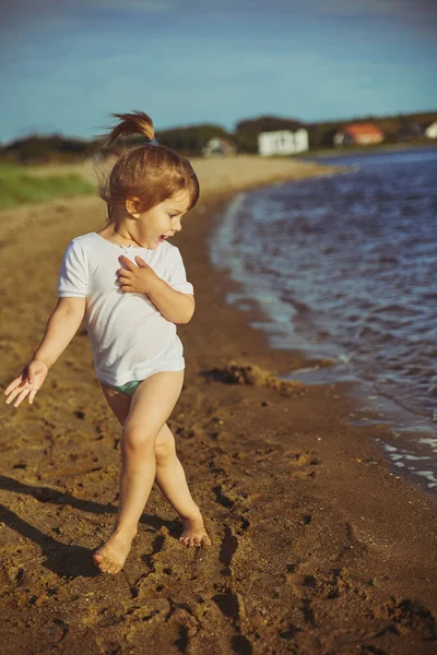 Child Running Away Sea Wave Sunset — Zdjęcie stockowe