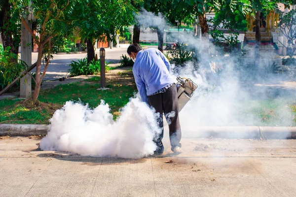 People fogging DDT spray for mosquito kill and protect by control mosquito is a carrier of Malaria, Encephalitis, Dengue and Zika virus in village.