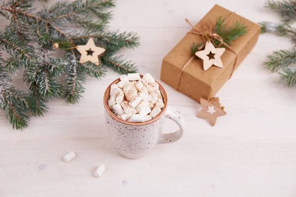 Christmas holiday background, banner or greeting card. Spruce branches, a mug of cocoa with marshmallows — Stock Photo, Image