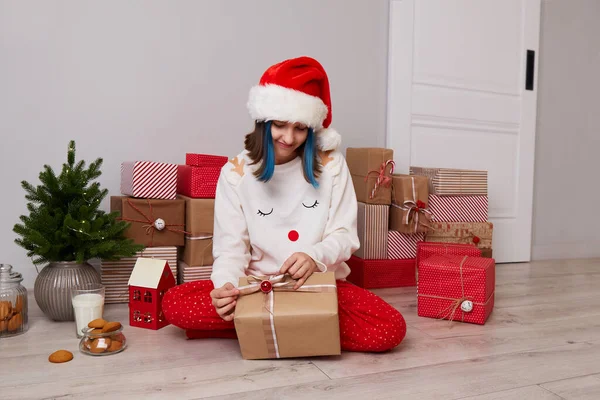 Happy Girl Pajamas Red Santa Hat Opens Christmas Gifts High — Stock Photo, Image