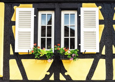 Renovated windows in village house clipart