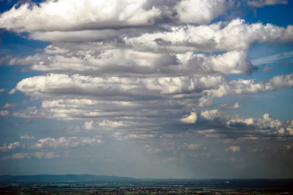 Big cumulus clouds over the land — Stock Photo, Image