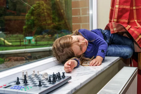 Little girl tired after chess game — Stock Photo, Image