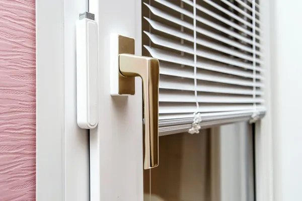 Aluminium blinds on PVC window — Stock Photo, Image