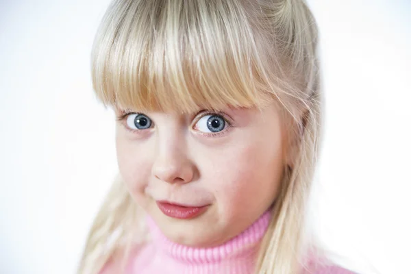 Cute little towhead girl surprising — Stock Photo, Image