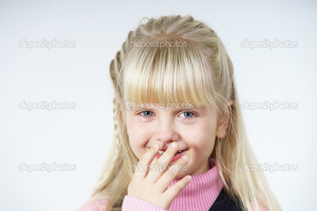 Cute little towhead girl crying