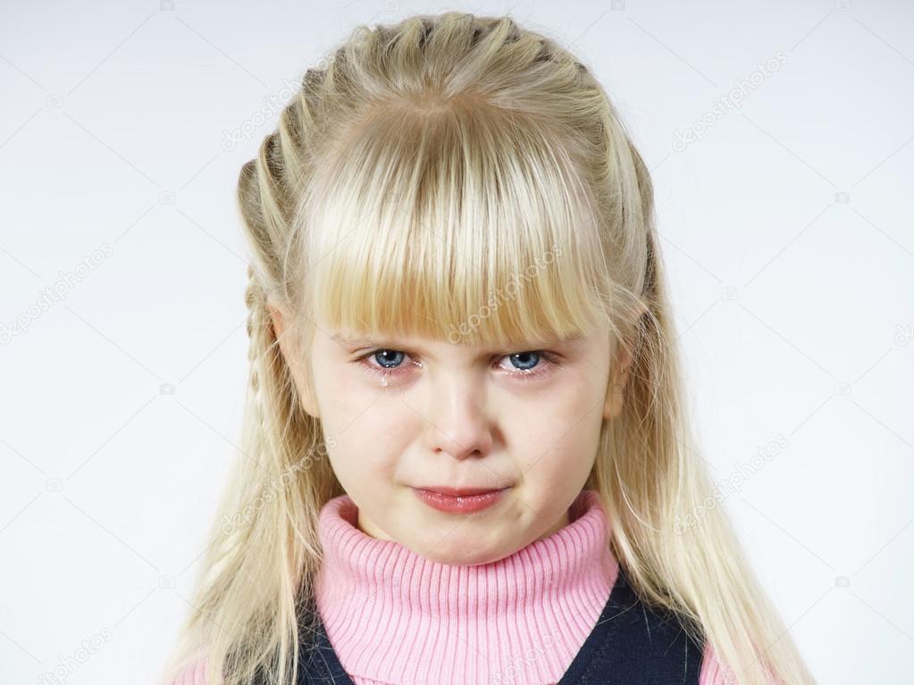 Cute little towhead girl crying