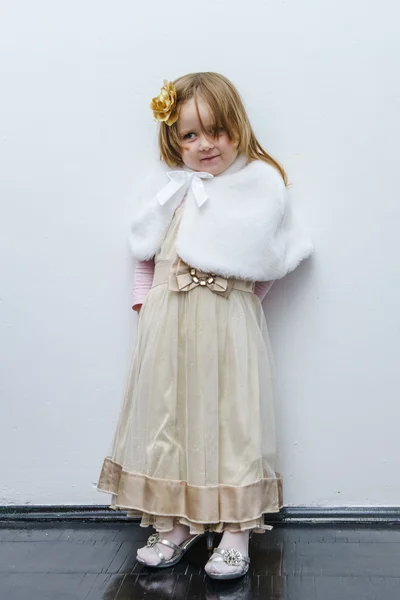 Cute little girl trying on dress — Stock Photo, Image