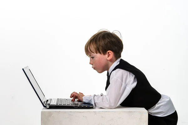 Freckled red-hair little boy with laptop. — Stock Photo, Image