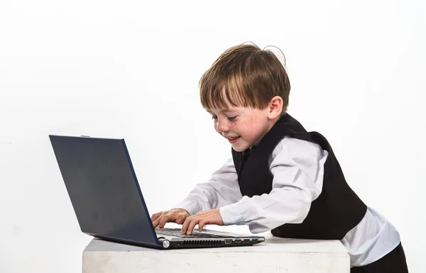 Freckled red-hair little boy with laptop. — Stock Photo, Image