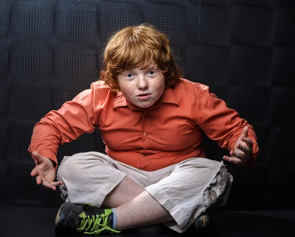 Freckled red-hair boy posing on dark background. — Stock Photo, Image