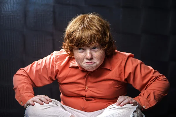 Freckled red-hair boy posing on dark background. — Stock Photo, Image