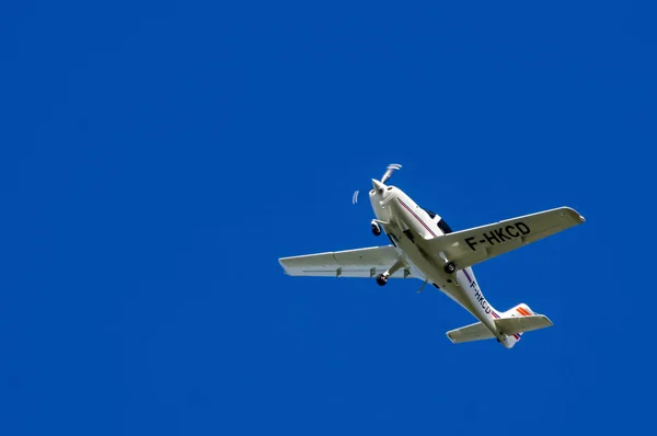 Small sport airplane in blue sky — Stock Photo, Image