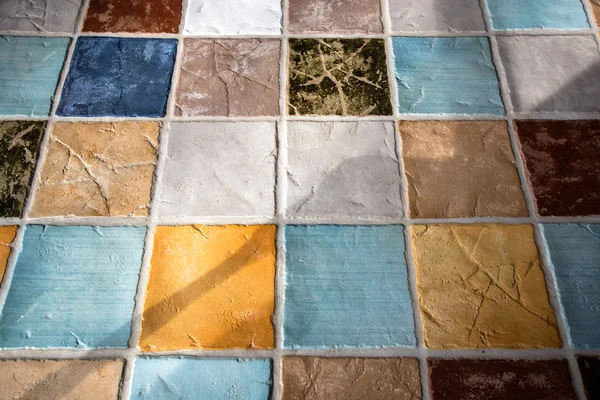 Colorful tile plunch on the floor — Stock Photo, Image