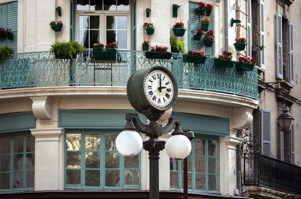 Retro style street clock with lantern — Stock Photo, Image