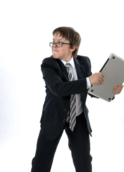Elegant teenage boy throws laptop — Stock Photo, Image