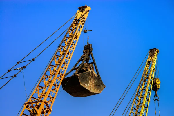 Old rusty buckets on sky background — Stock Photo, Image