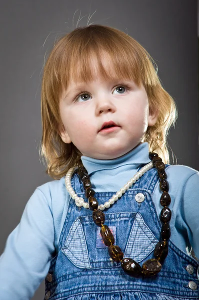 Cute little baby posing in studio. — Stockfoto