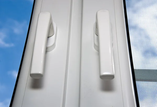 PVC handles on plastic window — Stock Photo, Image