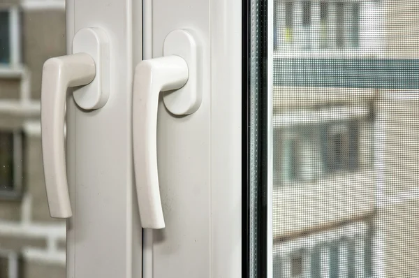 PVC handles on plastic window — Stock Photo, Image