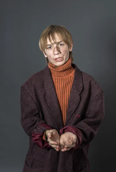 Young actor showing beggar — Stock Photo, Image