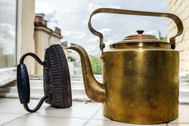 Retro  aeneous teapot and cast iron clipart