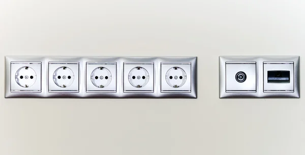 Electric sockets in line — Stock Photo, Image