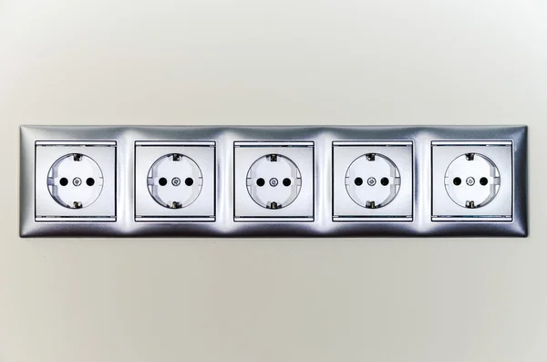 Electric sockets in line — Stock Photo, Image