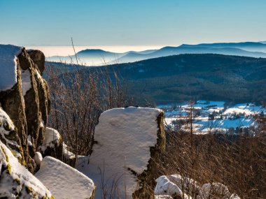 You can see the silhouettes of the Vosges mountains and the Alps in the distance. The Rhine Valley is shrouded in thick fog.