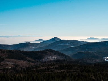 You can see the silhouettes of the Vosges mountains and the Alps in the distance. The Rhine Valley is shrouded in thick fog.