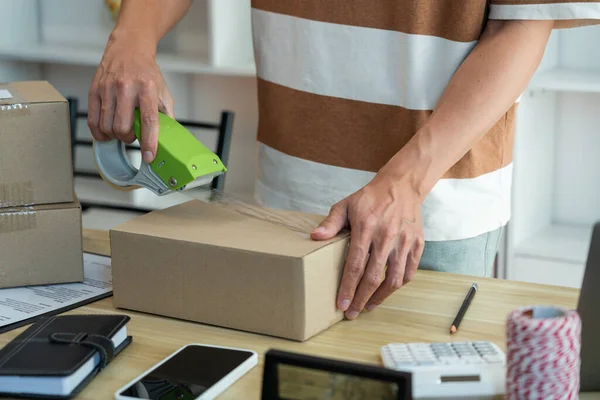 Online Shopping Concept Shop Seller Sealing Parcel His Goods Desk — Stock Photo, Image