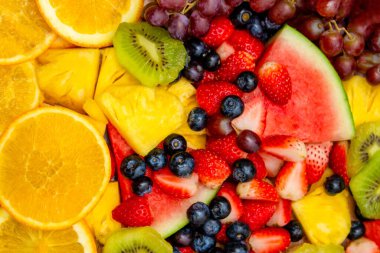 Taze meyve arka planı, sağlıklı karışık meyveler tropikal meyve ve çeşitli meyvelerden oluşur..