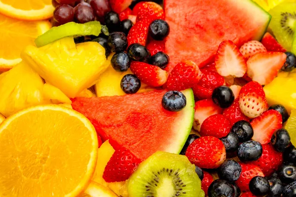 Fresh fruits background, Healthy mix fruits consist of tropical fruit and assorted berry.