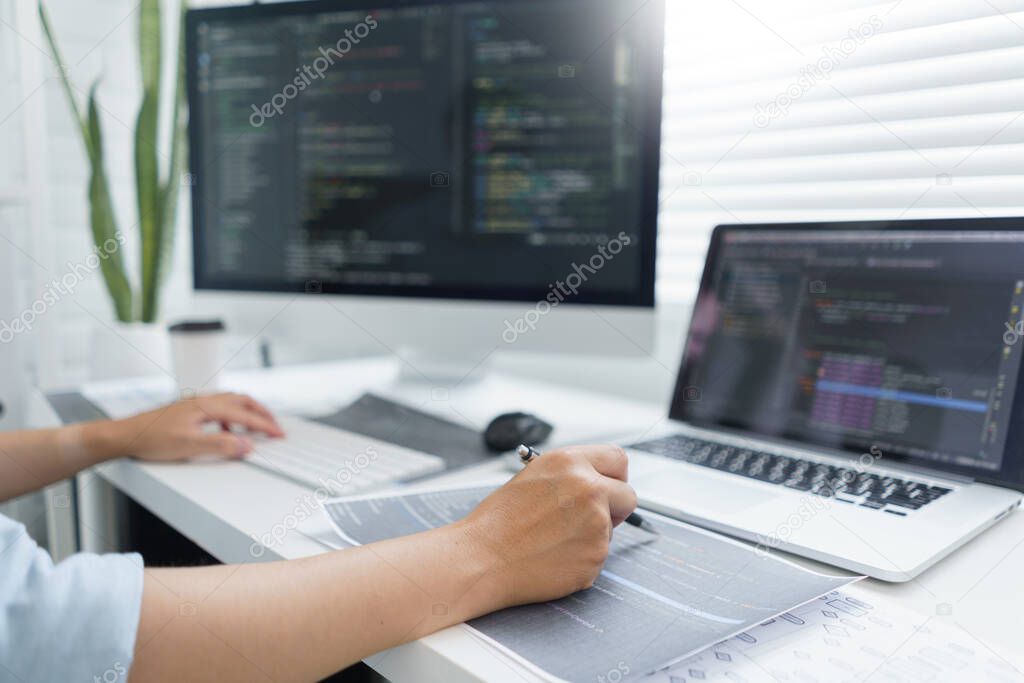 Software development concept, Male programmer pointing on data code to checking website programming.