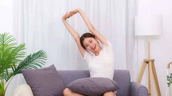 Lifestyle Living Room Concept Asian Woman Sitting Couch Stretching Relaxation — Stockfoto