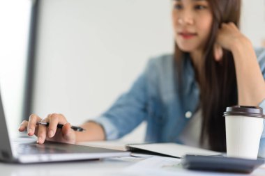 Construction business plan concept, Female architect working and drawing about house plan on laptop.