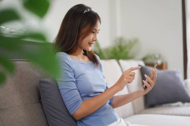 Work from home concept, Business women is chat with colleague on phone and working remotely at home.