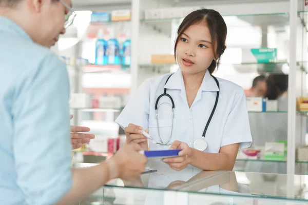 Medicine Health Concept Female Pharmacist Selling Medicine Explains Medication Client — стоковое фото