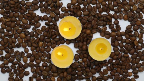 Video Clip Three Small Candles Burning Coffee Beans — Stock Video