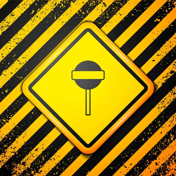 블랙 롤리팝 아이콘은 노란색 배경에서 분리되었다. 음식, 맛있는 상징. 경고 표지. Vector — 스톡 벡터