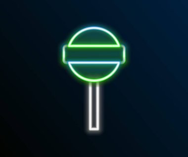Parlayan neon hattı lolipop simgesi siyah arkaplanda izole edildi. Yemek, lezzetli bir sembol. Renkli taslak konsepti. Vektör