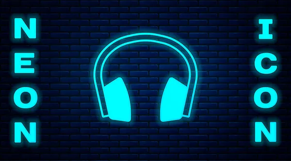 Świecący Neon Ikona Dźwiękochłonne Słuchawki Izolowane Tle Cegły Ściany Słuchawki — Wektor stockowy