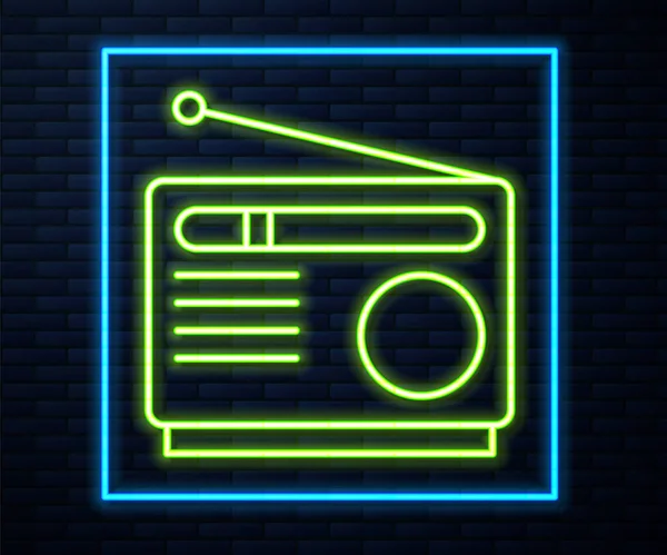 Leuchtendes Neon Line Radio mit Antennensymbol isoliert auf Backsteinwand Hintergrund. Vektor — Stockvektor