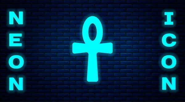 Parlayan neon haçı ankh simgesi tuğla duvar arka planında izole edildi. Mısır dilinde yaşam ya da ölümsüzlüğün sembolü. Vektör — Stok Vektör