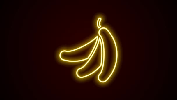 Светящийся неоновый символ банана выделен на черном фоне. Видеографическая анимация 4K — стоковое видео