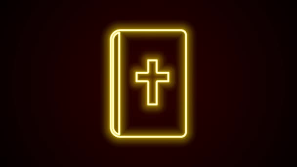 Glowing neon line Holy bible book icon isolated on black background. 4K Video motion graphic animation — Stock Video