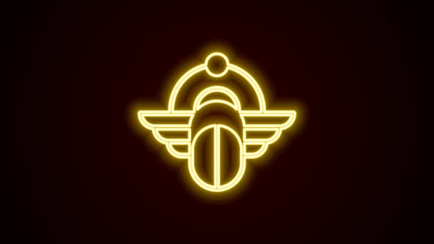 Glowing neon line Egyptian Scarab icon isolated on black background. Winged scarab Beetle and sun. 4K Video motion graphic animation — Video Stock