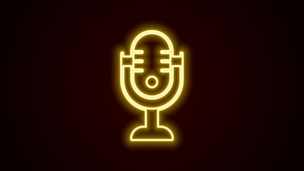 Glowing neon line Microphone icon isolated on black background. On air radio mic microphone. Speaker sign. 4K Video motion graphic animation — Stock Video