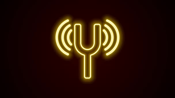 Glowing neon line Musical tuning fork for tuning musical instruments icon isolated on black background. 4K Video motion graphic animation — Stock Video