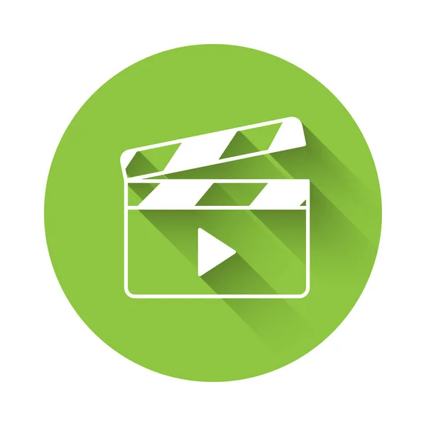 長い影の背景で隔離されたホワイトムービークラッパーアイコン フィルムクラッパーボード クラッパーボードのサインだ 映画制作やメディア業界 緑色の丸ボタン ベクトル — ストックベクタ